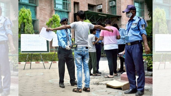 A NEET candidate in Delhi gets frisked before entering the exam centre | Credit: ANI Photo