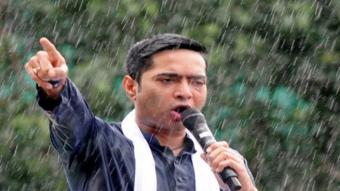 Trinamool Congress MP Abhishek Banerjee addresses a gathering at the TMC's Martyrs' Day Rally amid rainfall at Esplanade in Kolkata | ANI 