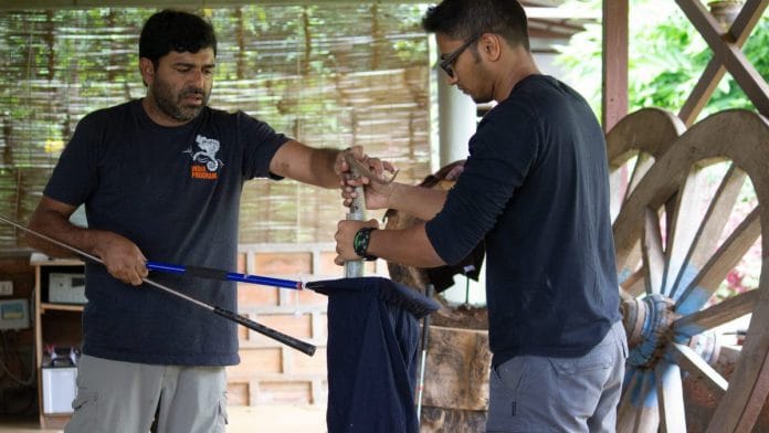 Gerry Martin and Sumanth Bindumadhav bagging a snake during one their studies. | Photo Credit: Humane Society International/India