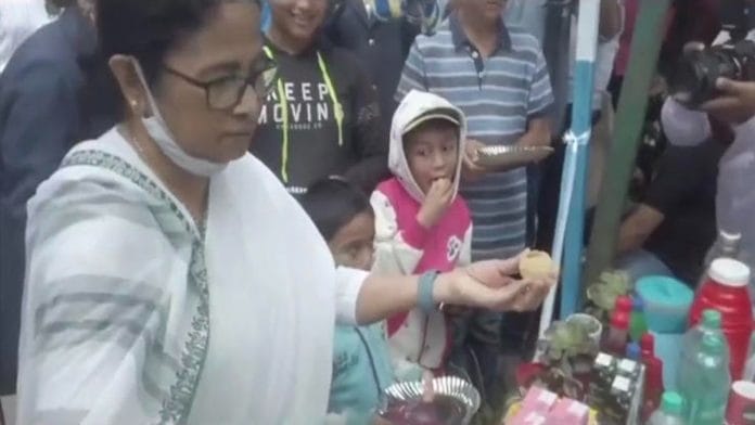 Chief Minister Mamata Banerjee making puchkas for children in Darjeeling | Credit: @AITCofficial