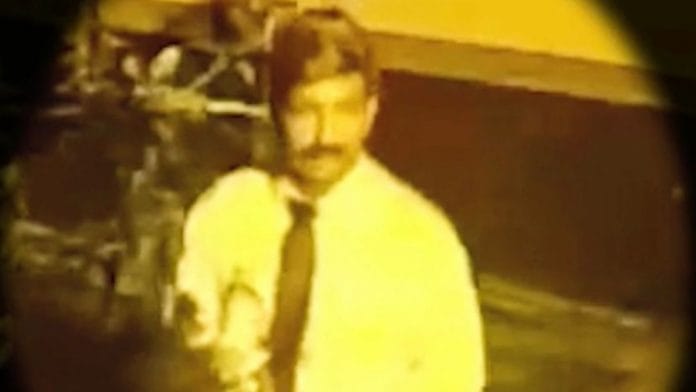 A screengrab of the Indian 'moustache man' from a Defimedia interview.