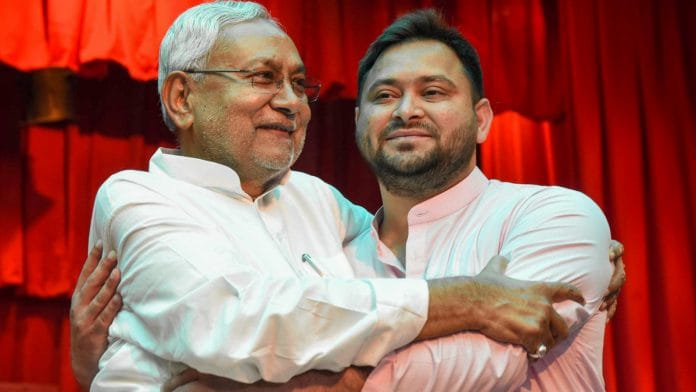 Bihar Chief Minister Nitish Kumar being greeted by Deputy Chief Minister Tejashwi Yadav after taking oath, at Raj Bhavan, Patna | PTI