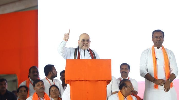 File photo of Union Home Minister Amit Shah along with former MLA Komatireddy Raj Gopal Reddy at public rally in Munugode | Twitter | @AmitShah