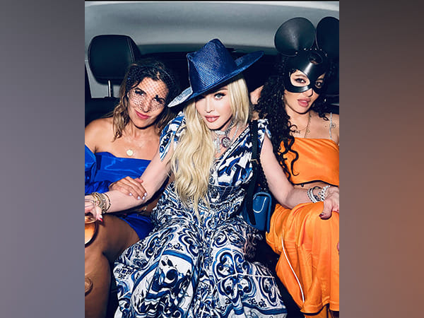 Madonna passionately kisses two women on 64th birthday in Italy, see video