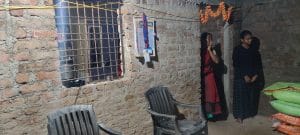Pooja, 17, stands quietly in a corner with her mother in their dimly lit, one-room shanty with exposed brick walls in Parsodi village near Yavatmal | Nidhima Taneja | ThePrint
