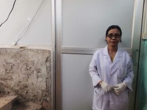 Dalimi Baruah outside the clinic on the second floor of the bare bodied building | Angana Chakrabarti | ThePrint