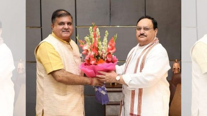 Mahendra Bhatt with BJP chief JP Nadda (File Photo/ANI)