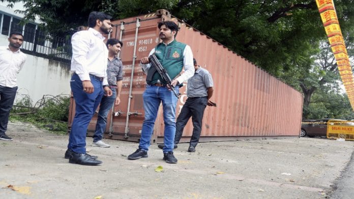 Special Cell members stand guard near a container with more than 20,000 kg of licorice root coated with heroin that was seized from JNPT Port in Mumbai | ANI