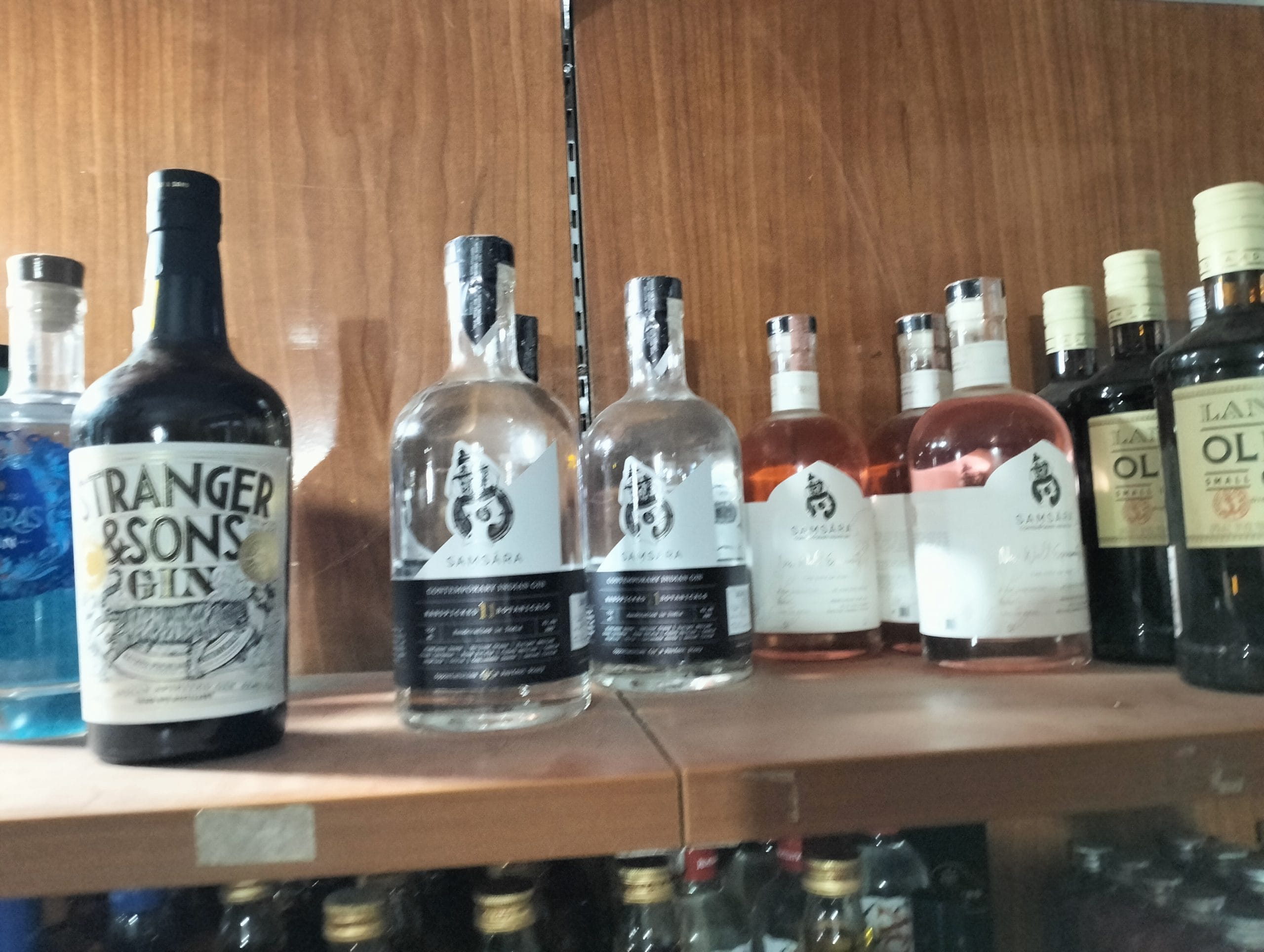  A shelf in a supermarket in Goa's Morjim displays various Indian gins.| Credit: Tina Das