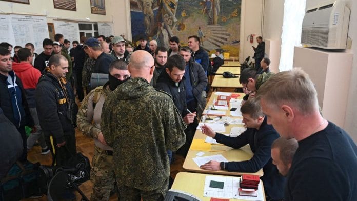 Reservists drafted during the partial mobilisation arrive at a gathering point before their departure for military bases in the Rostov region, Russia, on 26 September 2022 | Reuters