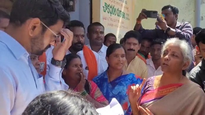 Screengrab of Union Finance Minister Nirmala Sitharaman talking with Kamareddy Collector Jitesh V. Patil over photographs of the PM not displayed at a ration shop | Twitter | @nsitharaman