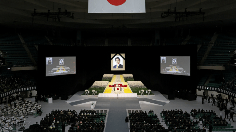 With flowers and a gun salute, Japan bids farewell to Abe at state funeral