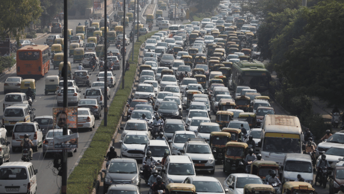 Vehicles queue at a traffic light on a hazy morning in New Delhi on 16 October 2020 | Anushree Fadnavis via Reuters