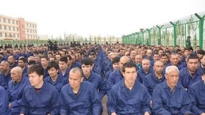 Detainees in a Xinjiang 're-education camp' located in Lop County listening to 