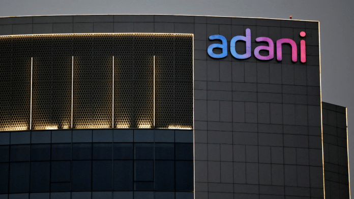 File Photo: The logo of the Adani Group is seen on the facade of one of its buildings on the outskirts of Ahmedabad, India, 13 April, 2021 / Reuters/ Amit Dave