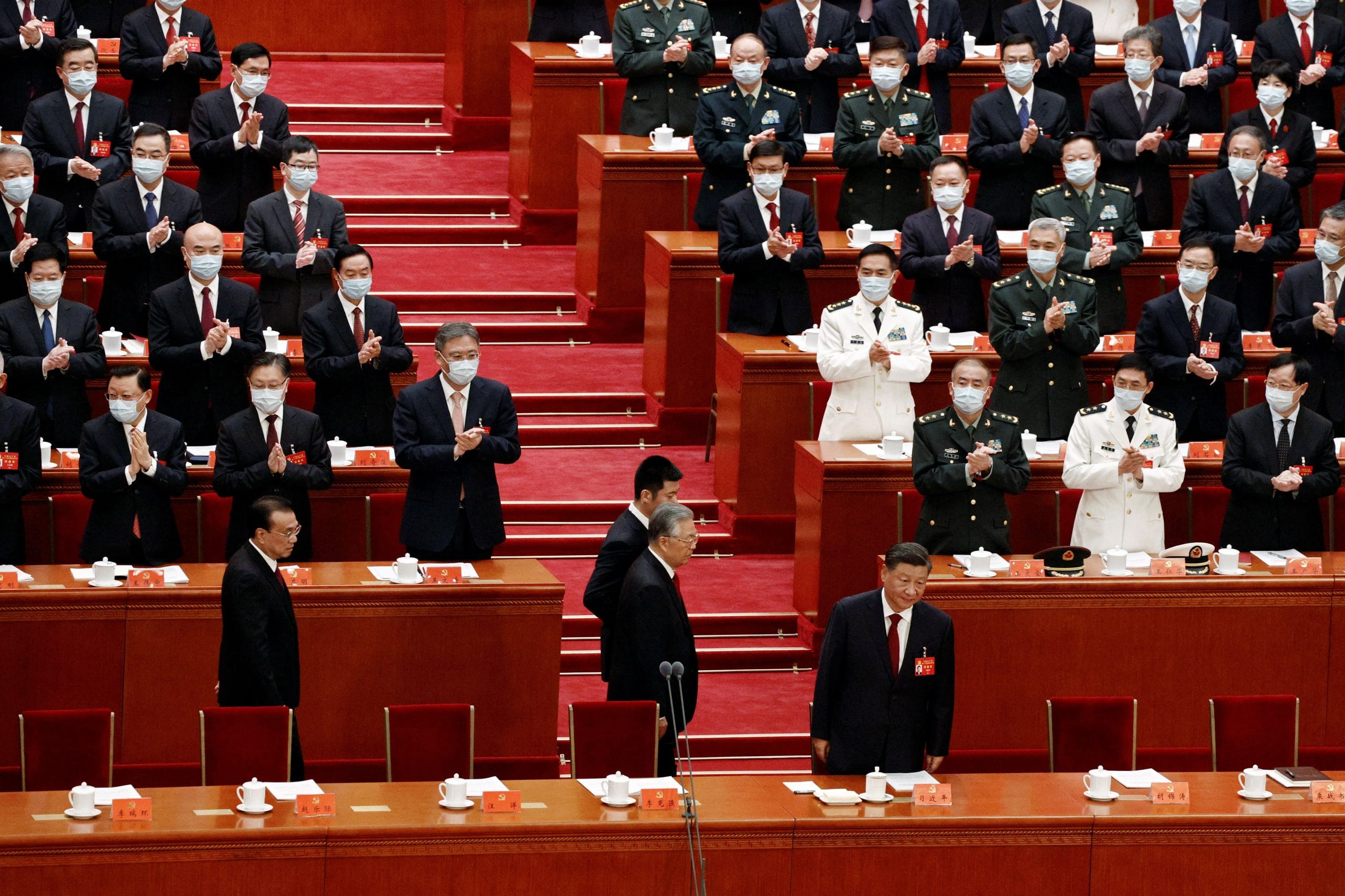 Chinese President Xi Jinping, former president Hu Jintao and Premier Li Keqiang arrive for the opening ceremony of the 20th National Congress of the Communist Party of China, at the Great Hall of the People in Beijing on 16 October 2022 | Reuters 