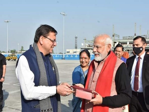 Uttarkhand CM gifts PM Modi a traditional cap carved with Brahma Kamal