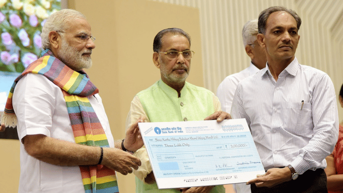 File photo of Prime Minister, Shri Narendra Modi distributing the awards to cooperative societies, at the Birth Centenary Celebration of Laxman Rao Inamdar and Sahakar Sammelan, in New Delhi | Wikimedia Commons