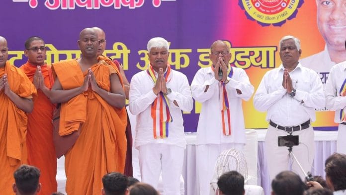 Delhi social welfare minister Rajendra Pal Gautam (centre) at the event Wednesday | Twitter | @AdvRajendraPal