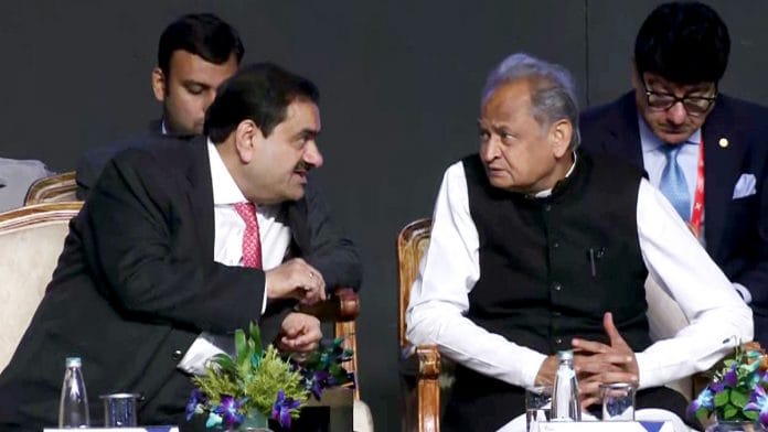 Rajasthan Chief Minister Ashok Gehlot interacts with Adani Group Chairman Gautam Adani at the Invest Rajasthan Summit 2022 Friday | ANI