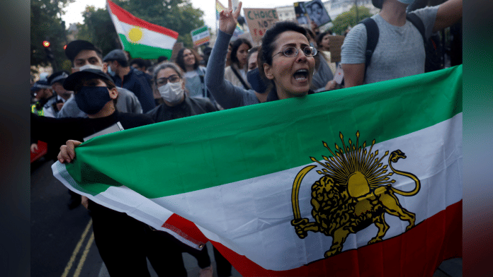 FILE PHOTO: Protestors stand in solidarity with Iranian women after the death of Mahsa Amini, in London, Britain September 24, 2022. REUTERS/Clodagh Kilcoyne//File Photo