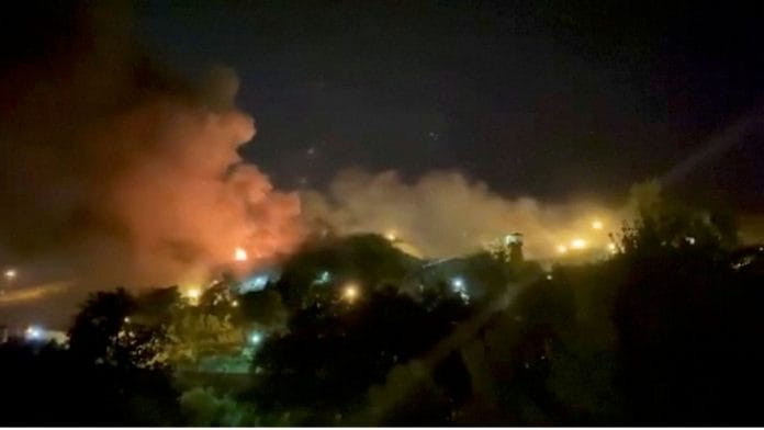 A view of smoke rising from Evin Prison in Tehran, Iran, on 15 October 2022 | Reuters