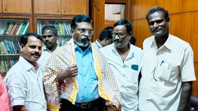 VCK chief Thol. Thirumavalavan (in blue) at a public meeting | Twitter/ @thirumaofficial