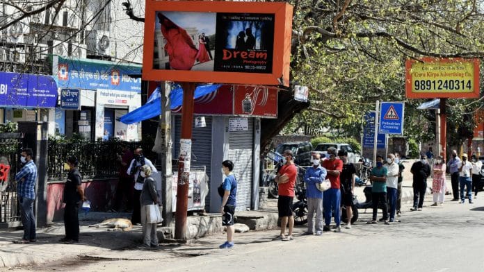People in socially-distanced queues waiting to withdraw money from the ATM during the lockdown | Representational image | ANI