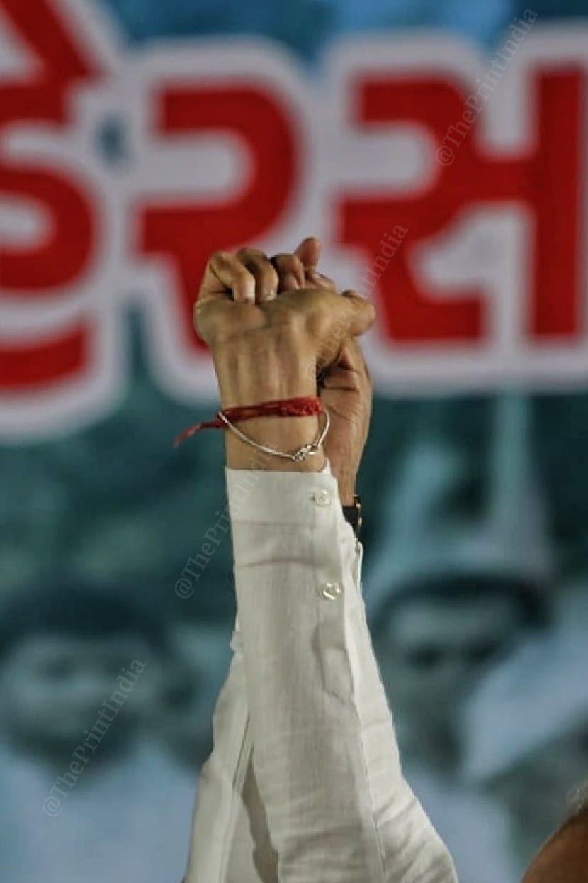 Both the leaders join hands during the rally | Photo:Praveen Jain | ThePrint
