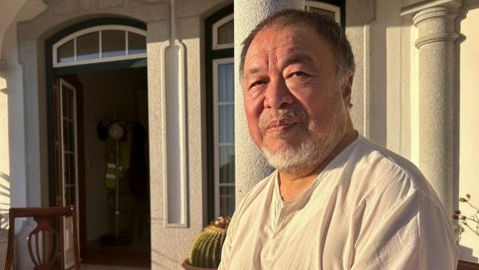 Chinese dissident artist Ai Weiwei poses for a picture after an interview in Montemor-O-Novo, Portugal, on 28 November | Reuters/Catarina Demony