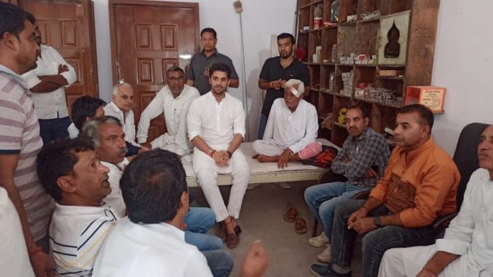 BJP's Bhavya Bishnoi with his supporters in Adampur | Twitter | @bbhavyabishnoi