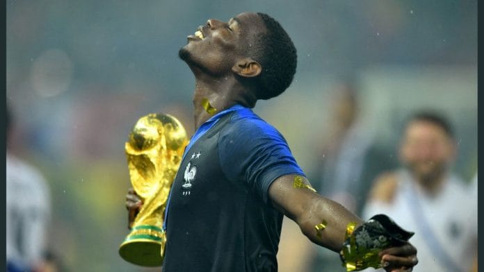 France's Paul Pogba holds the trophy as he celebrates winning the World Cup | Reuters file photo/Dylan Martinez/