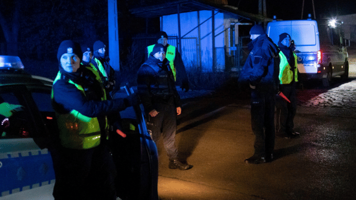 Police block a road, amid reports of two explosions, in Przewodow, Poland, November 15, 2022. Jakub Orzechowski/Agencja Wyborcza.pl via Reuters