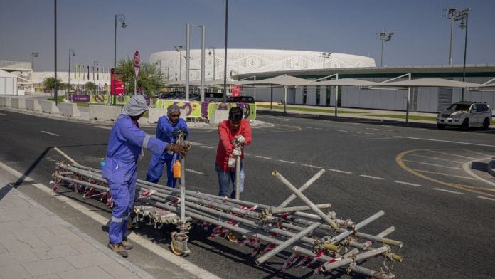 File photo of a general view of construction workers outside the stadium ahead of the FIFA World Cup Qatar 2022 at Al Thumana Stadium, Doha, Qatar on 17 November, 2022 | Reuters
