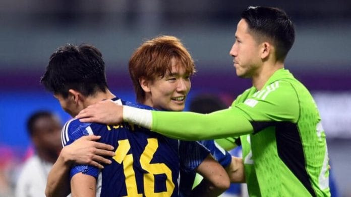Japan's Kou Itakura celebrates with Takehiro Tomiyasu and Daniel Yabuki after the match at Khalifa International Stadium, Doha, Qatar on 23 November, 2022 | Reuters
