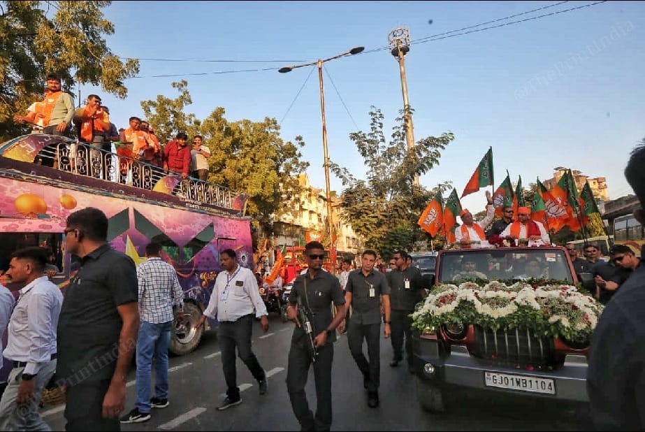 Security personnel accompanying CM Patel's roadshow | Photo: Praveen Jain | ThePrint