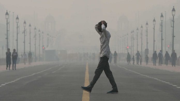 Commuters walk on Kartavya Path amid severe smog in New Delhi, on 4 November 2022 | Suraj Singh Bisht | ThePrint