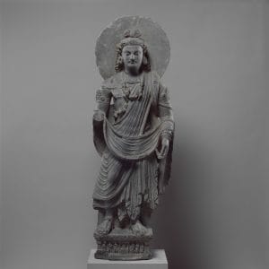 Standing Bodhisattva Maitreya (Buddha of the Future), Pakistan (ancient region of Gandhara), c. 3rd century, Gray schist. Image courtesy of The Metropolitan Museum of Art.
