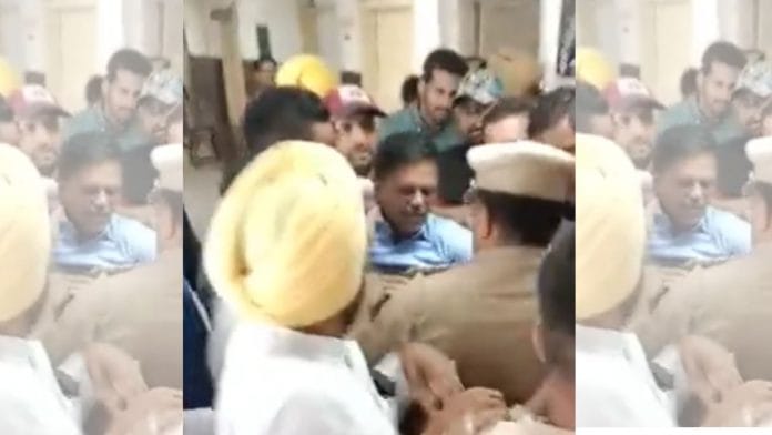 AAP candidate Kanchan Jariwala (in blue shirt) at the Returning Officer’s office in Surat on 16 November 2022 | Photo: Twitter/@Gopal_Italia