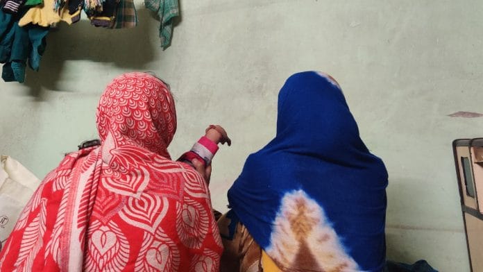 Deepak’s wife holding their three-year-old son (left) and his sister at their residence in Kalyanpuri | Photo: Bismee Taskin | ThePrint