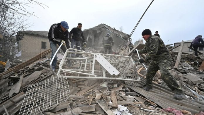 Rescuers work at the site of a maternity ward of a hospital destroyed by a Russian missile attack, as their attack on Ukraine continues, in Vilniansk, Zaporizhzhia region, Ukraine 23 November 2022 | Reuters/Stringer