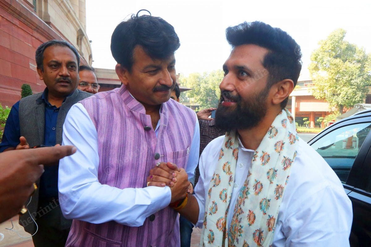 MP Manoj Tiwari shakes hands with MP Chirag Paswan | Photo: Praveen Jain | ThePrint