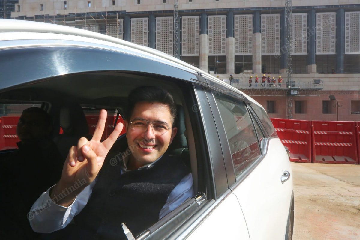AAP Rajya Sabha MP Raghav Chadha shows victory sign after party's win at MCD elections | Photo: Praveen Jain | ThePrint