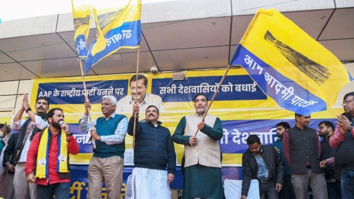 Delhi environment Minister Gopal Rai, AAP leader Sanjay Singh and others celebrate after Delhi CM and and AAP national convenor Arvind Kejriwal declare AAP as national party, at party HQ, in New Delhi on Thursday. | ANI