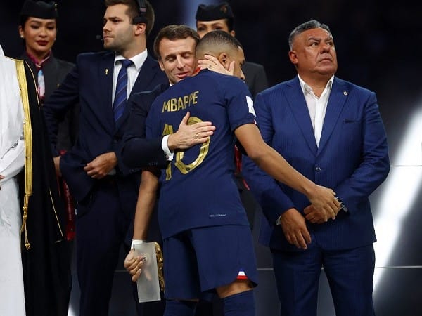 Macron consoles French football team after defeat to Argentina in FIFA World Cup final 