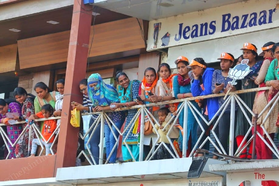 Women stand on balconies to catch a glimpse of PM Modi | Photo: Praveen Jain | ThePrint