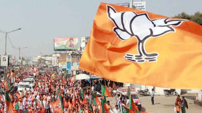BJP supporters at a roadshow by Union Home Minister Amit Shah in Ahmedabad | ANI