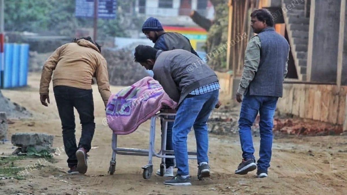 Relatives of 42-year-old Mukesh Kumar Singh rush him to the Sadar Hospital for post-mortem | Credit: Praveen Jain, ThePrint