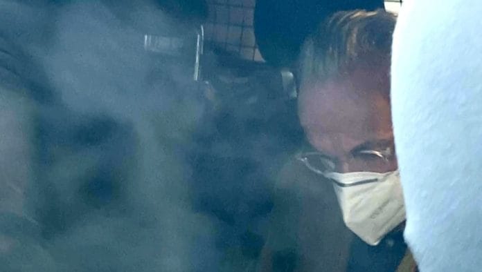 Prince Heinrich XIII P. R. is seen inside a police car | Tilman Blasshofer/Reuters TV via Reuters