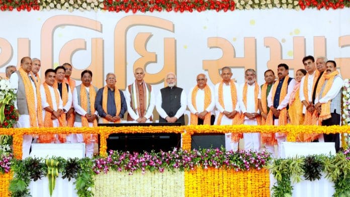 PM Narendra Modi poses with Gujarat Governor, CM Bhupendra Patel and the new council of ministers in Gandhinagar Monday | ANI